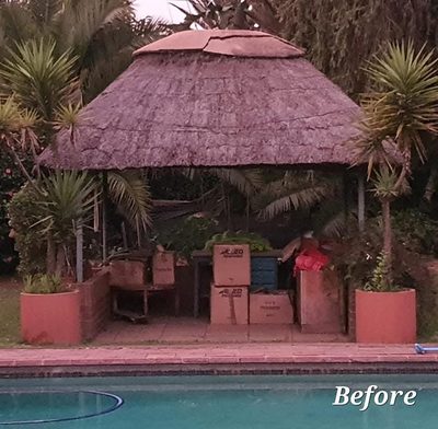 A poolside braai gazebo with an ageing thatch roof and painted walls, before re-thatching.